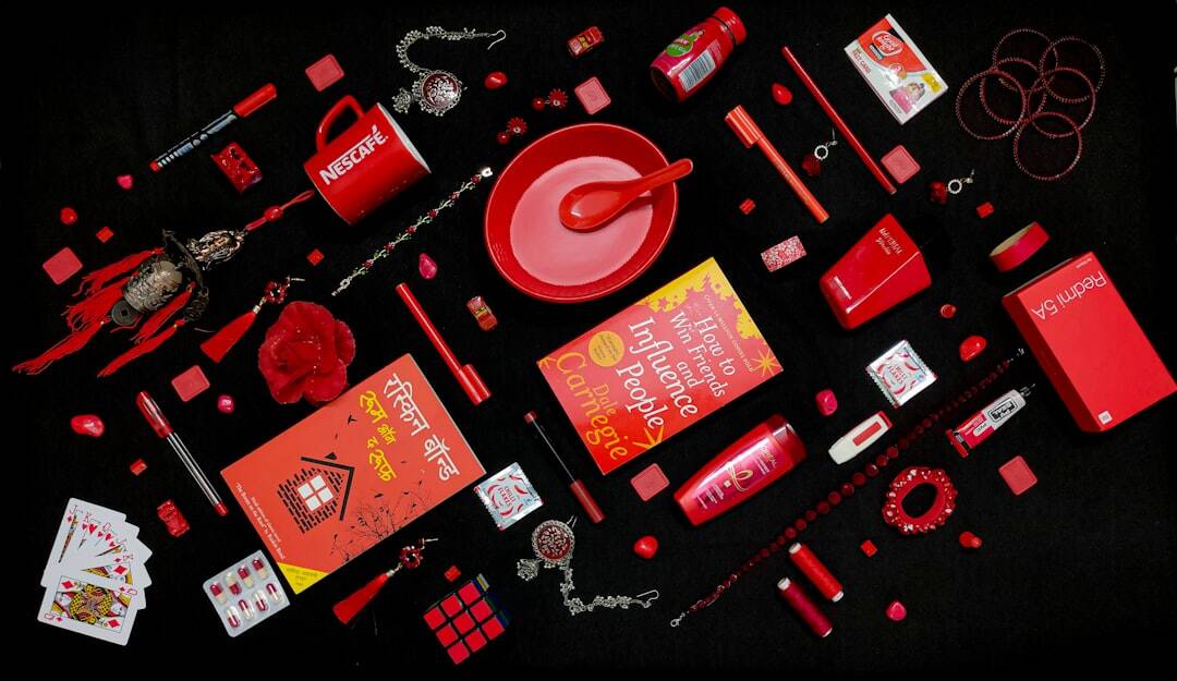 promotional-marketing-products-events-guide-image Array of red San Marcos promotional products on a black background.